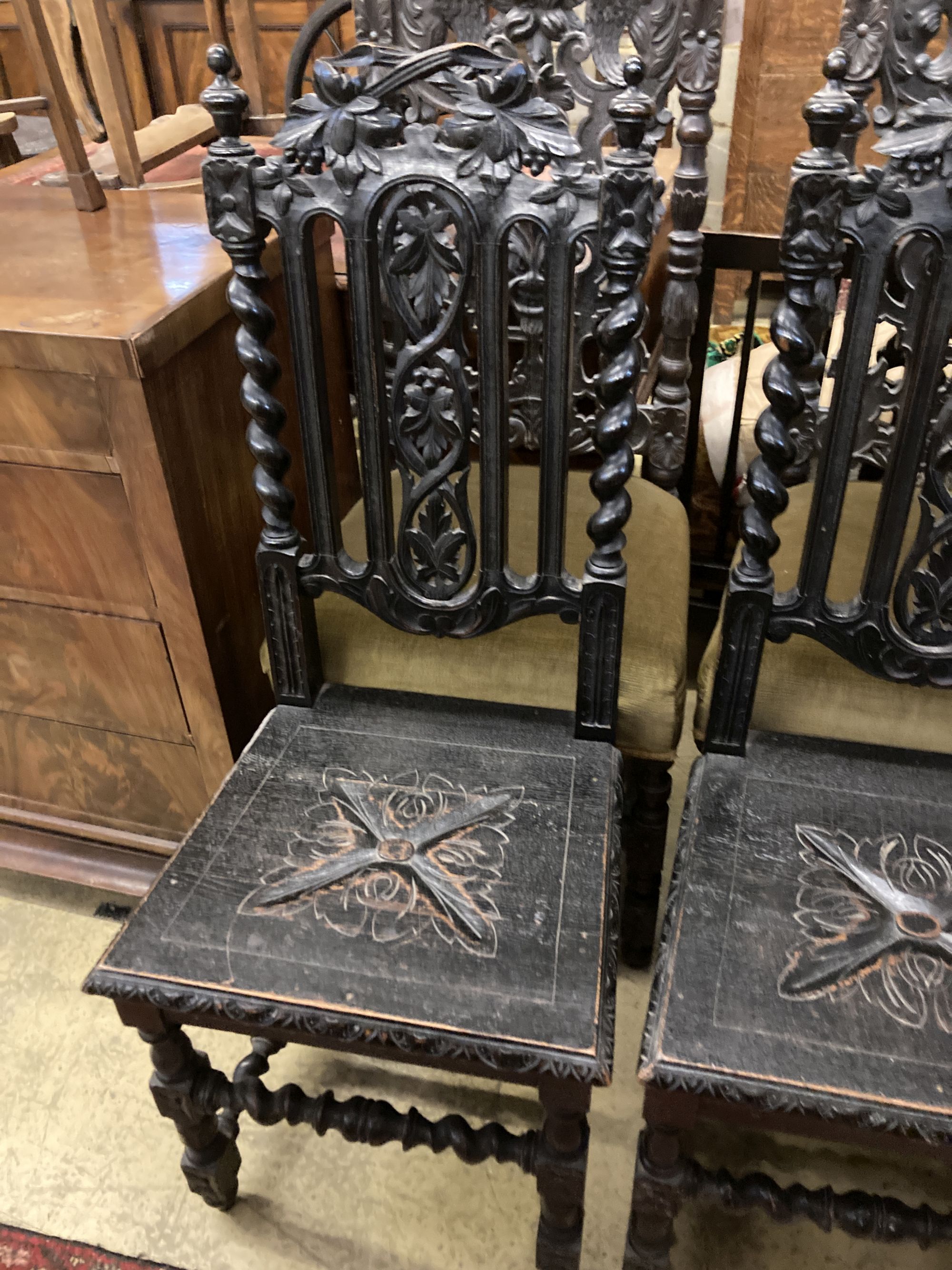 Two pairs of Victorian carved oak dining chairs